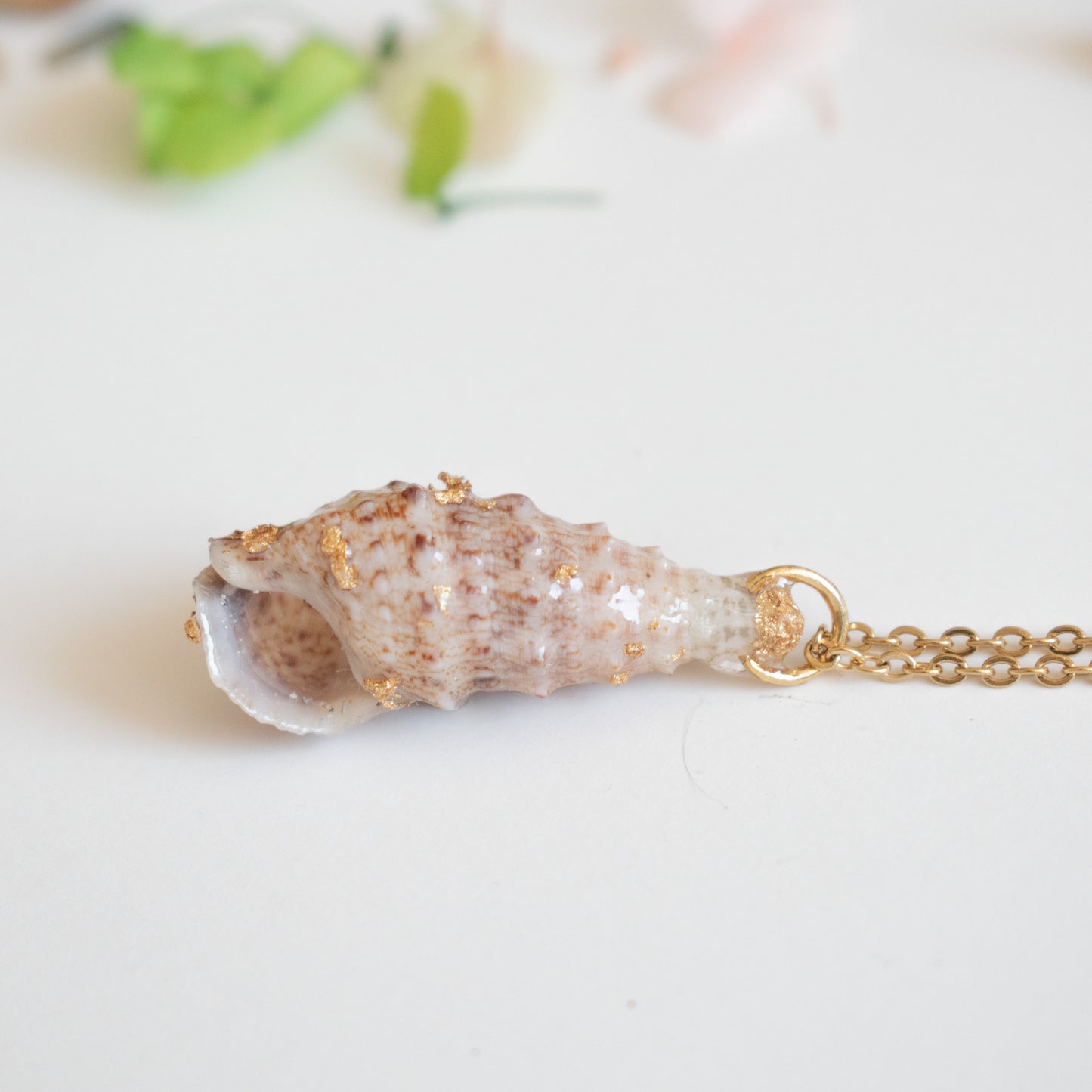 Colgante con caracol marino